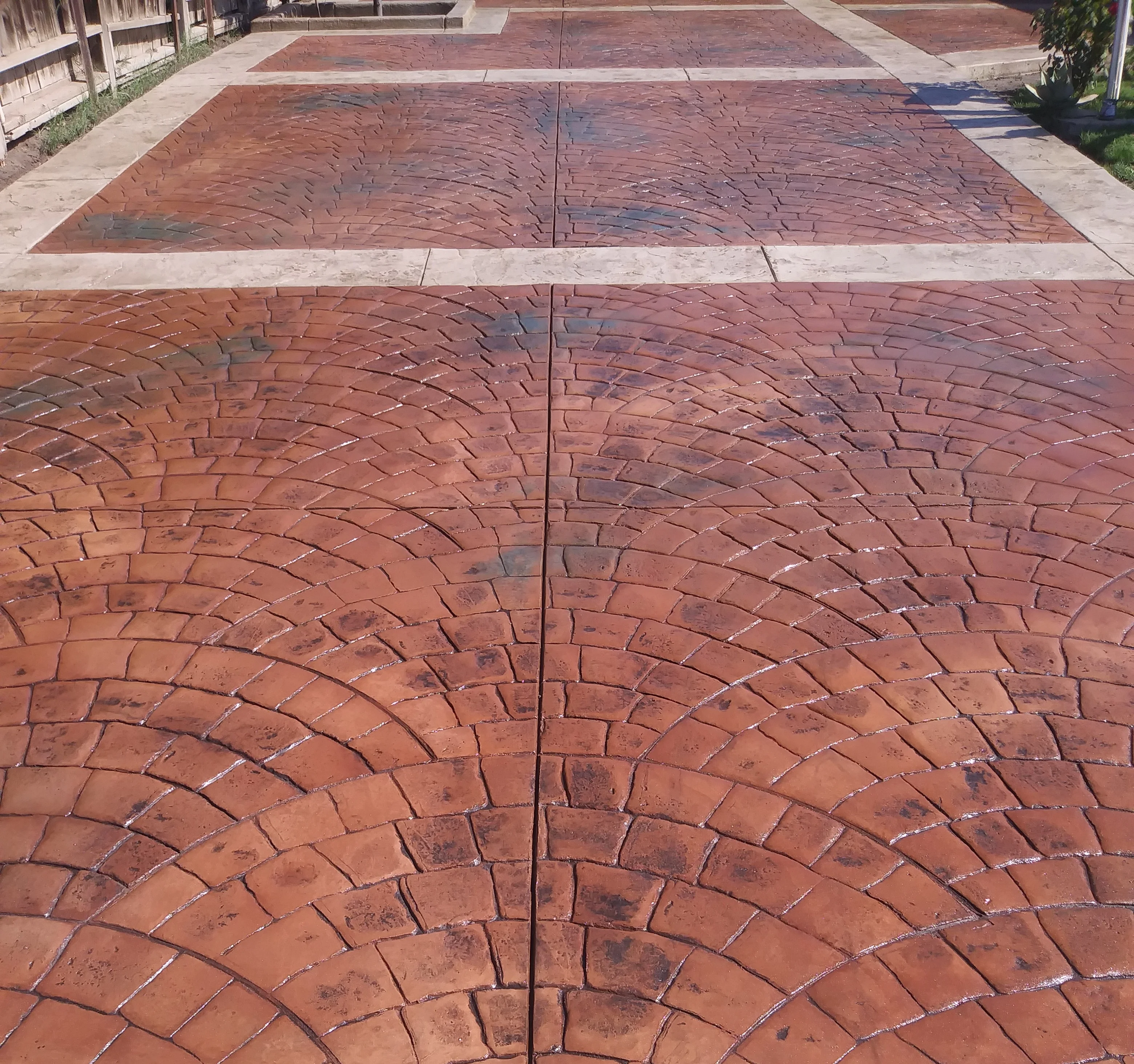 Red stamped concrete patio