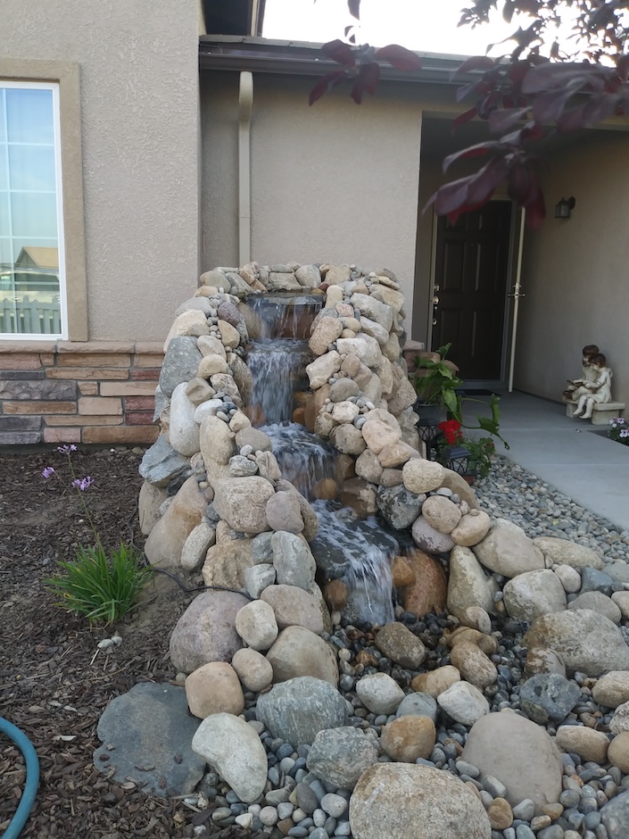 Frontyard waterfall made of rocks