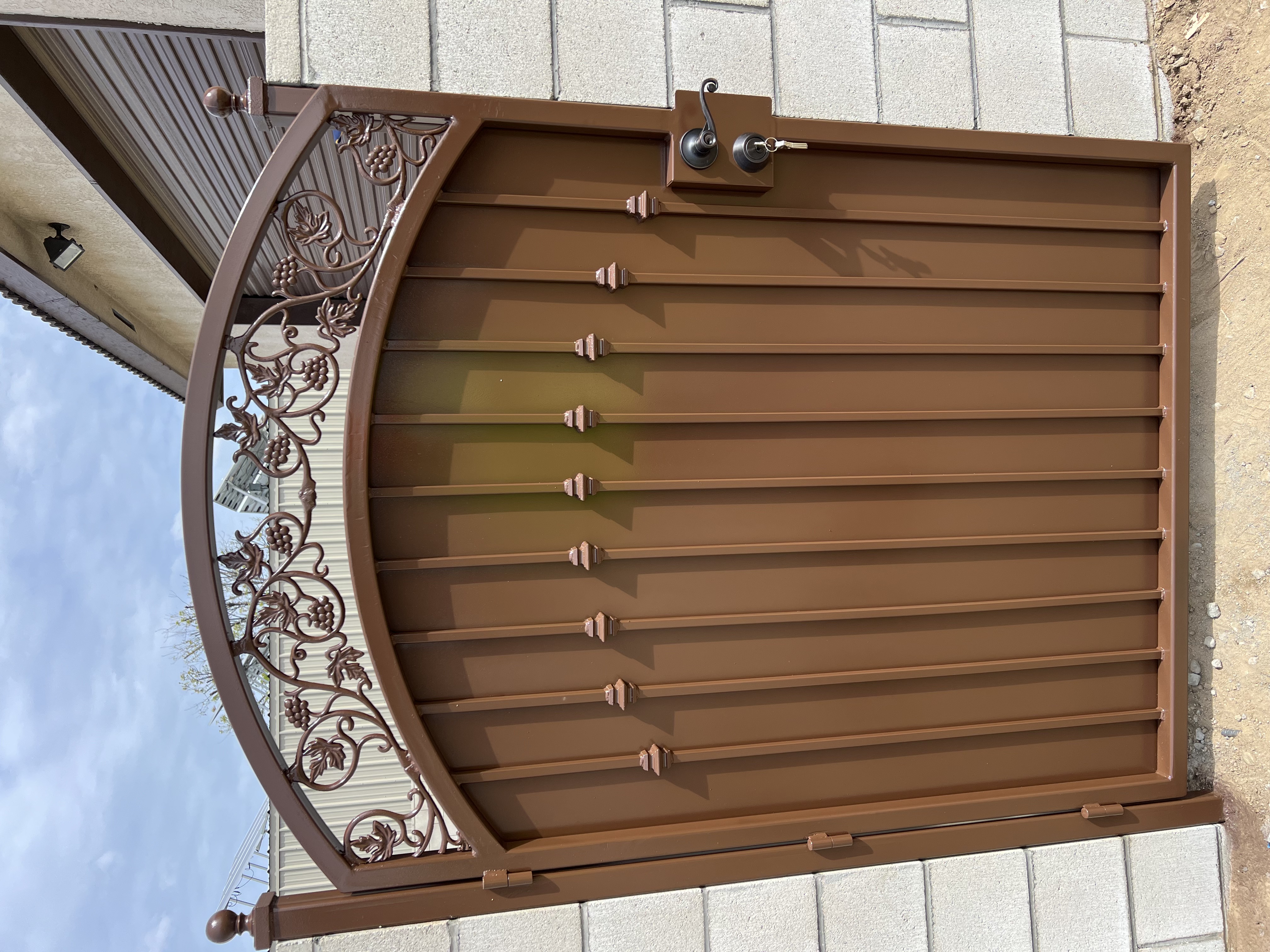 Custom wrought iron gate with ornate detailing